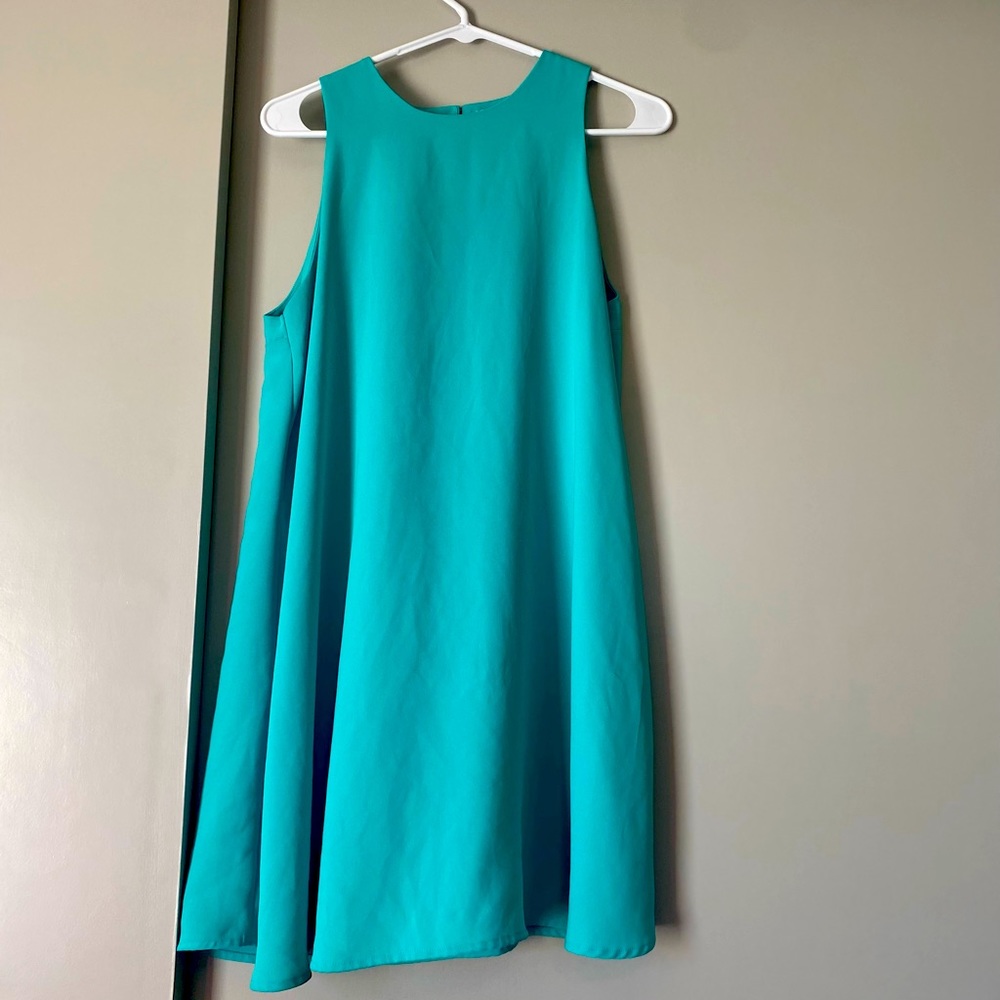 Turquoise thigh length dress. It’s flowy and super comfortable